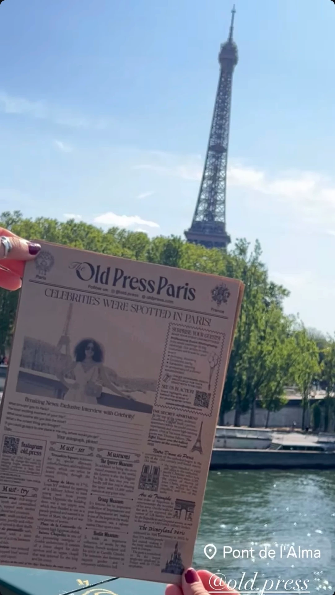Paris Old Press newspaper held up at Pont de l'Alma with the Eiffel Tower behind